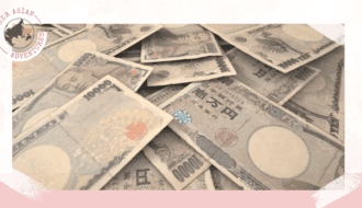 Her Asian adventure. Cover photo that shows different local currencies to travel Asia with cash