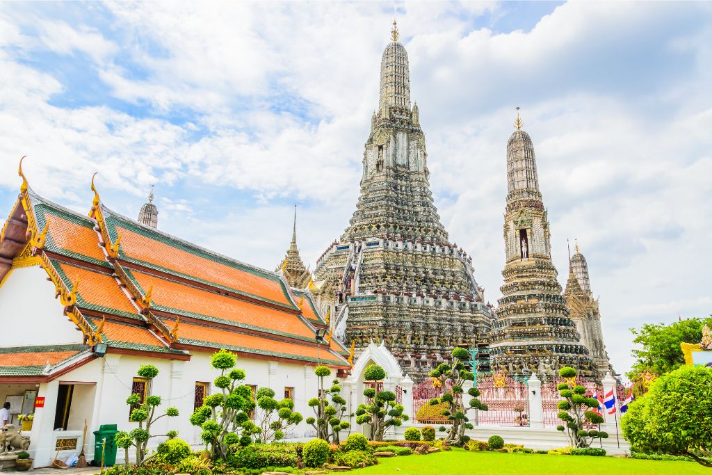 Wat Arun, the Temple of Dawn in Bangkok, Thailand, standing tall with intricate spires. A reason to travel to Thailand is its rich cultural landmarks, making Thailand worth a visit for history lovers.