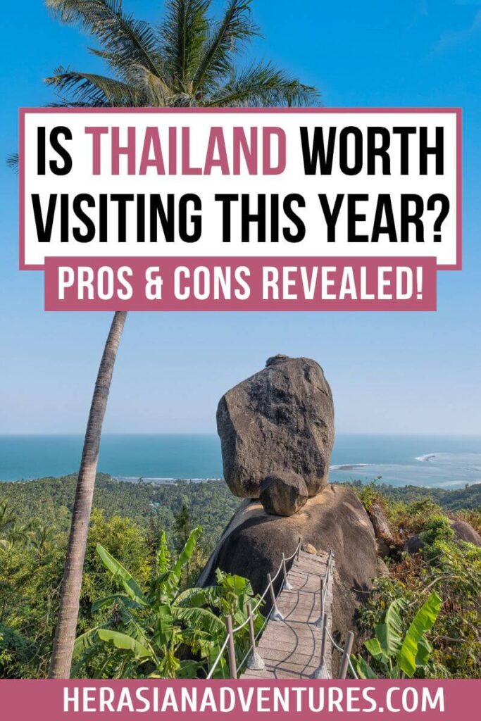 "Is Thailand worth visiting this year? Pros & cons revealed!" text overlay on an image of a scenic viewpoint with a large boulder, tropical trees, and ocean views. If you're wondering why Thailand is worth visiting or considering the pros and cons of traveling to Thailand, this destination offers stunning natural beauty and tropical adventures.