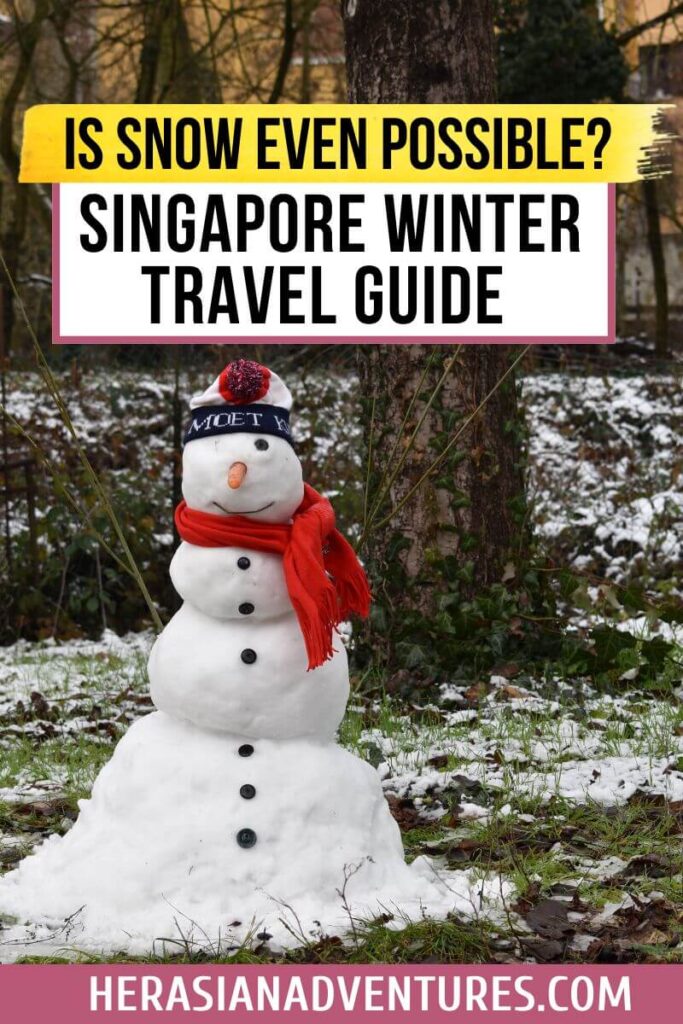 A cheerful snowman with a red scarf and winter hat stands on a snowy lawn with surrounding trees. Text overlay reads, "Is Snow Even Possible? Singapore Winter Travel Guide." Playfully explores the idea of winter in Singapore.