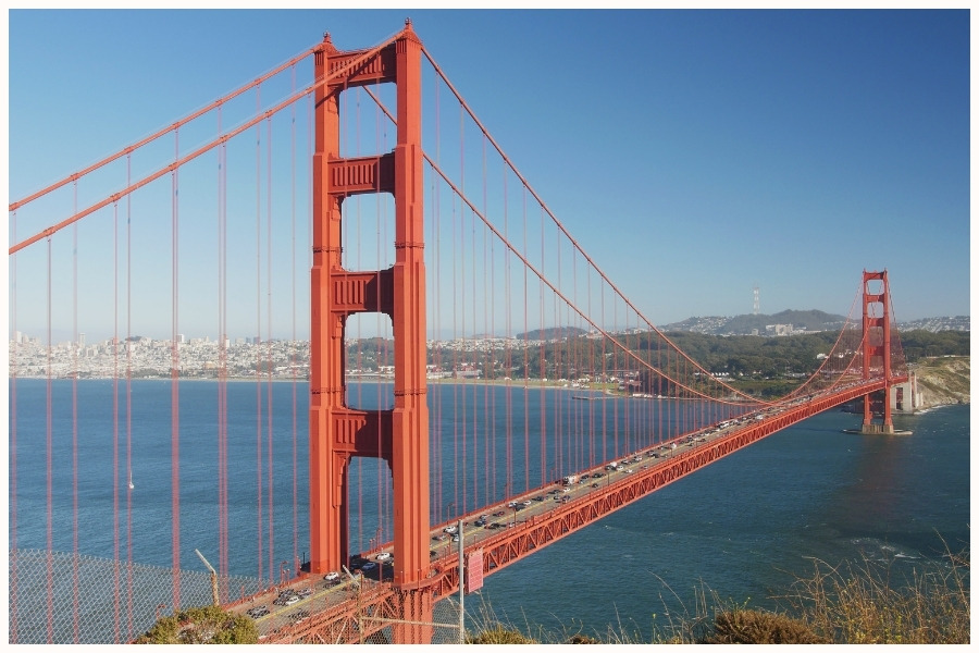 The Golden Gate Bridge in San Francisco on a sunny day, showcasing California. Flight time to Singapore from the USA, including New York and California, is around 17-24 hours.