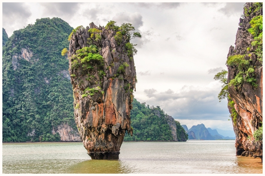 The famous rock formation in Phang Nga Bay, Thailand, illustrating popular spots for travelers heading to Singapore from nearby countries.