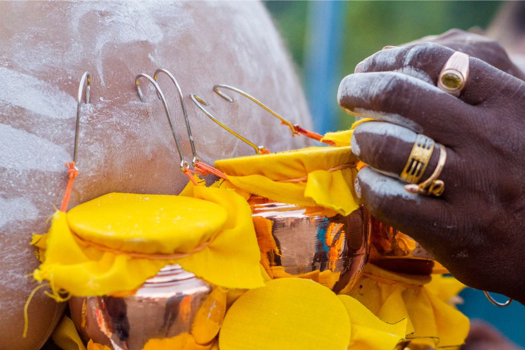 Close-up of ceremonial pots with hooks used in a religious offering at Batu Cave temple in Kuala Lumpur, Malaysia. Batu Caves is a prominent Hindu temple and one of the top Batu Caves attractions, especially during religious festivals like Thaipusam.