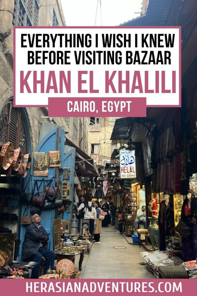 Image with text “Everything I Wish I Knew Before Visiting Bazaar Khan El Khalili”: A guide to exploring Khan El Khalili bazaar in Cairo, Egypt, featuring a bustling street filled with shops selling leather goods, lanterns, and traditional souvenirs under a clear sky.