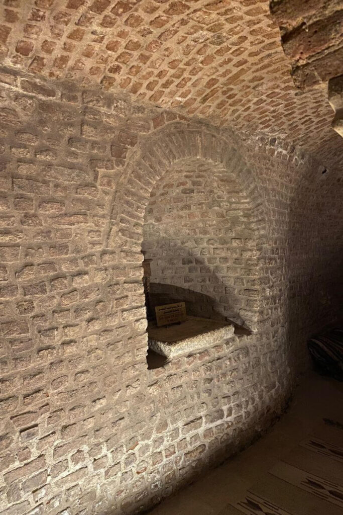 An arched brick alcove within the ancient walls of the Abu Serga Church in Coptic Cairo, reflecting the timeless beauty of Coptic Christianity and its significance in Bible history and Christian heritage.