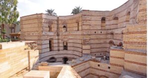 The massive stone walls and arches of the Babylon Fortress in Coptic Cairo, a testament to Roman and Coptic history in Ancient Cairo and a UNESCO World Heritage Site.