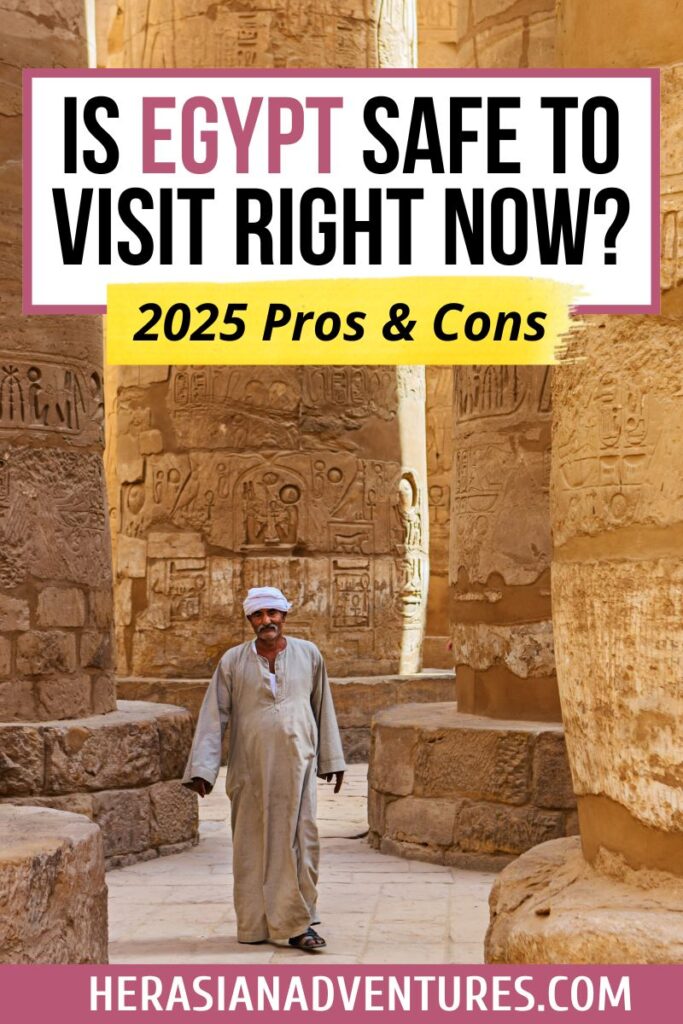 A man in traditional Egyptian attire walks through the ancient Karnak Temple complex with massive hieroglyphic-covered columns. The text overlay reads “Is Egypt safe to visit right now? Pros & Cons of visiting egypt right now,” addressing one of the key reasons not to go to Egypt or why to visit Egypt depending on perspective.