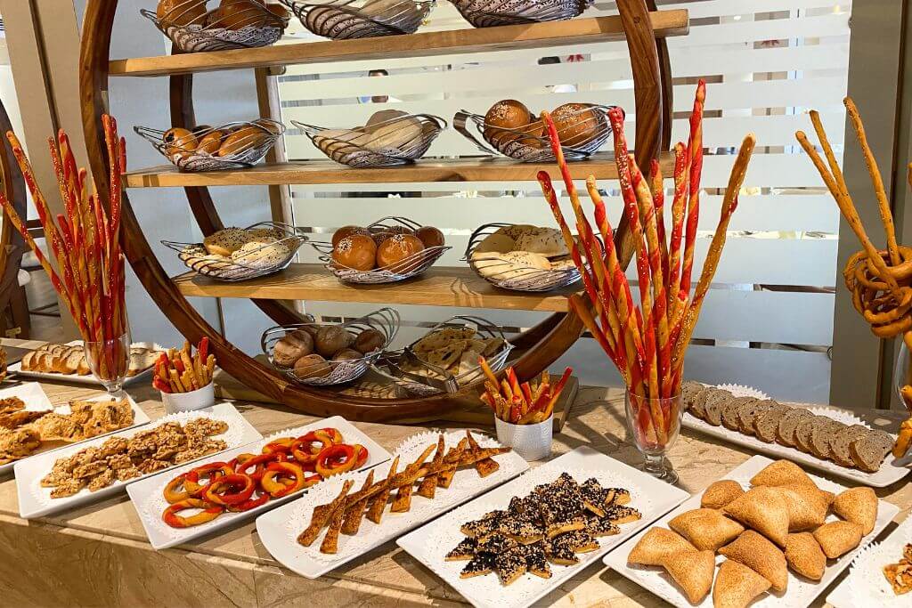 A beautifully presented buffet with various breads, pastries, and snacks aboard a Nile cruise. For food lovers asking “why should I visit Egypt,” this captures a delicious reason to go.