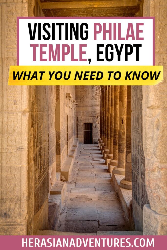 Vertical corridor photo titled “Visiting Philae Temple, Egypt – What You Need to Know,” showing hieroglyphic-covered columns inside the Temple of Isis Philae on Aswan Island.