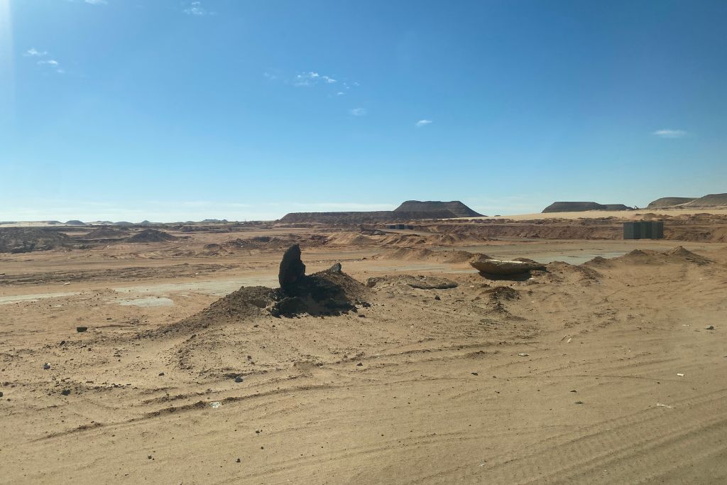 Wide-angle shot of the Abu Simbel temples with a crowd in front, illustrating the popularity of day trips from Aswan to Abu Simbel and the enduring appeal of these ancient ruins.