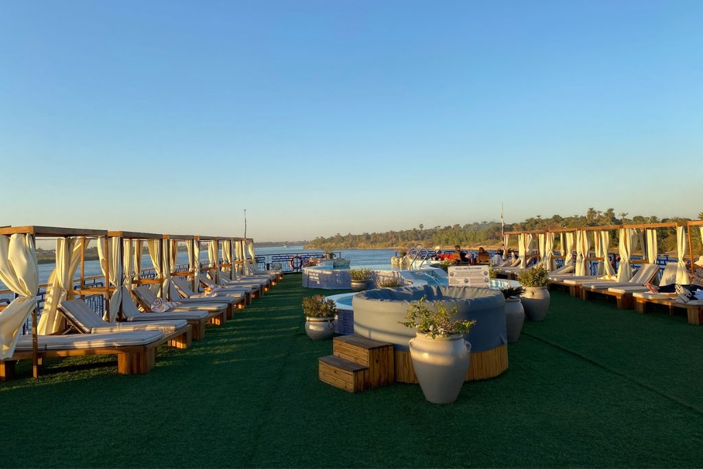 Scenic view of a cruise ship’s sun deck along the Nile, offering a relaxed way to travel from Aswan to Abu Simbel by river—one of the more scenic answers to how to get to Abu Simbel from Aswan.