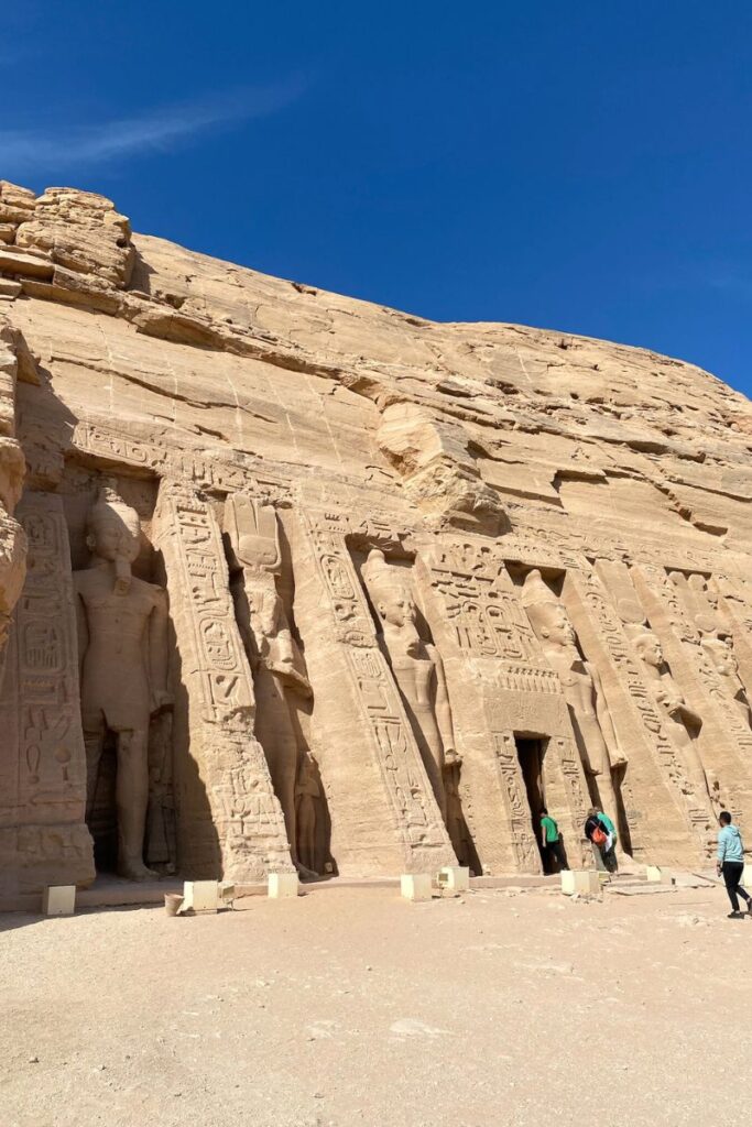 Temple of Hathor at Abu Simbel, featuring standing statues of Queen Nefertari and Ramses II surrounded by detailed carvings; this lesser-known site is a gem among Abu Simbel attractions and temples at Abu Simbel.