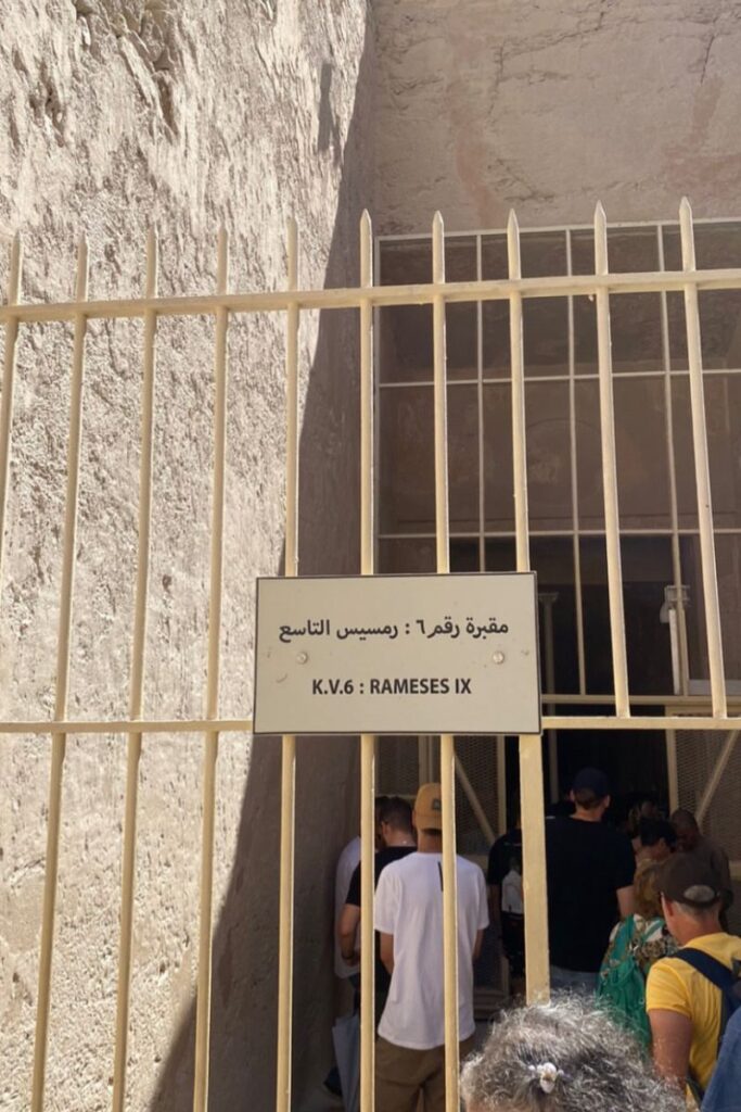 Entrance gate with a sign marking tomb K.V.6: Rameses IX at the Valley of the Kings. This tomb is one of many open to the public and an example of what you can explore when visiting Luxor.