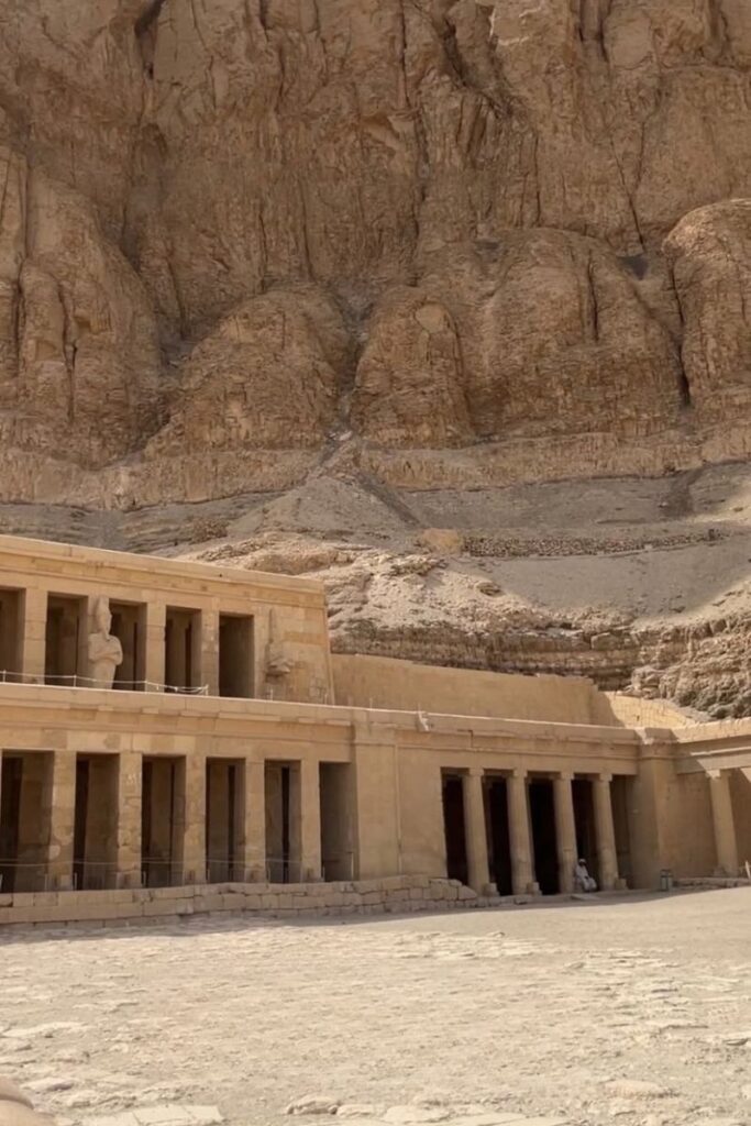 Temple of Hatshepsut carved into the cliffs at Luxor, with stone columns and statues in front of a dramatic desert backdrop. A popular excursion for a day trip from Hurghada or Cairo to Hurghada itinerary.