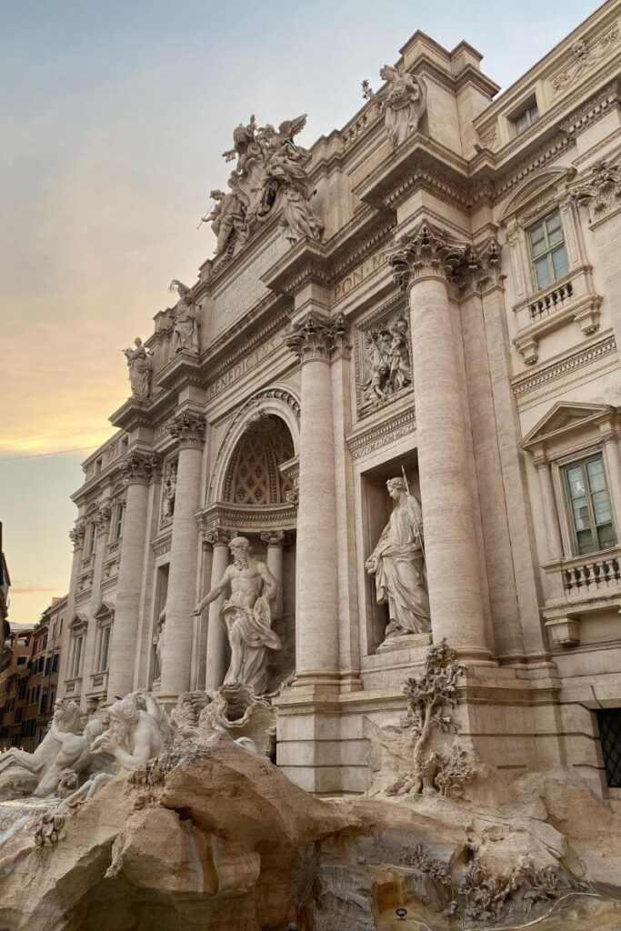 Rome’s iconic Trevi Fountain captured during golden hour, with its grand baroque sculptures and soft lighting. A strong image for posts about traveling to Italy alone, best solo travel destinations in Europe, or best places to travel solo Europe.