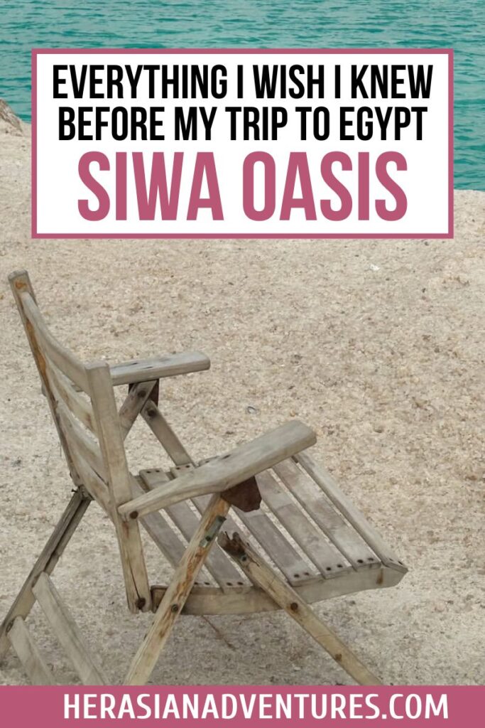 A broken wooden chair sits by a turquoise lake in Siwa Oasis; overlaid text reads “everything I wish I knew before my trip to egypt – siwa oasis,” offering tips for a siwa oasis trip or egypt backpacking journey.