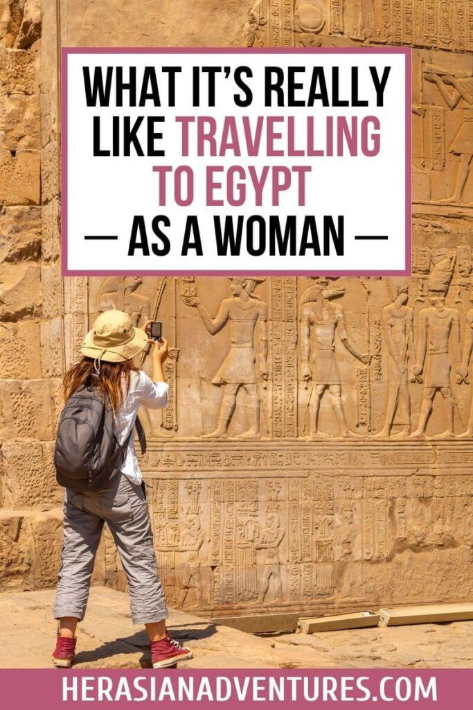 A woman photographs wall carvings at an Egyptian temple with a blog graphic reading “What It’s Really Like Travelling to Egypt as a Woman.” Designed to answer is Egypt safe for women with first-hand experiences and advice.