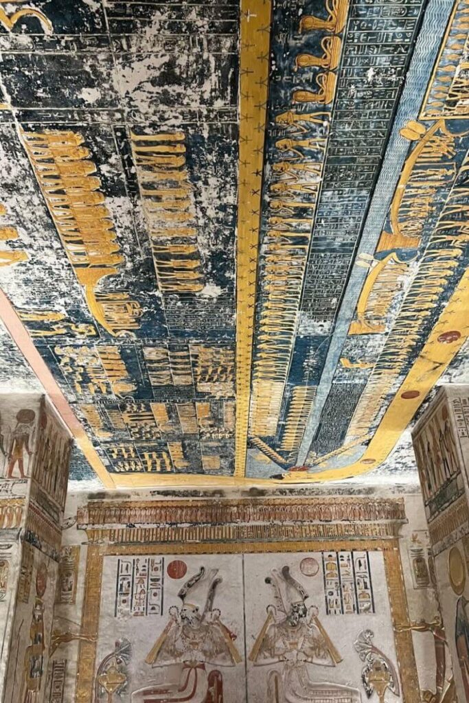 Ceiling art in vivid blue and gold depicting ancient Egyptian cosmology inside a royal tomb in the Valley of the Kings. A must-see highlight for any Egypt itinerary 10 days or history-focused itinerary in Egypt.