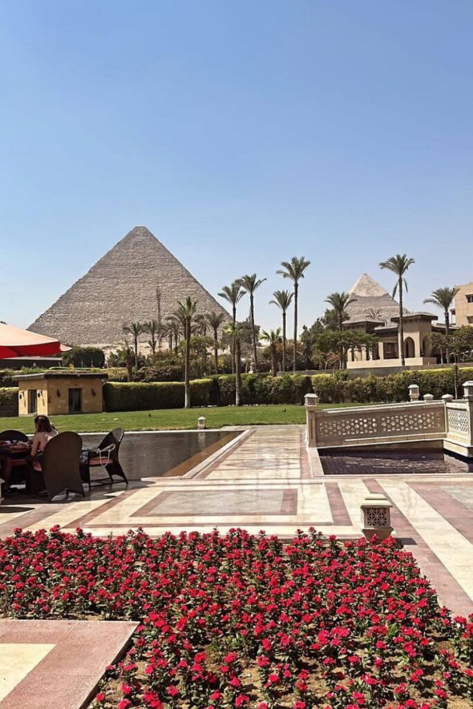 Stunning luxury hotel garden and patio overlooking the Great Pyramids – perfect for Cairo Egypt blog posts, hotel recommendations, and tips for visiting Egypt in comfort and style, especially for first-timers.