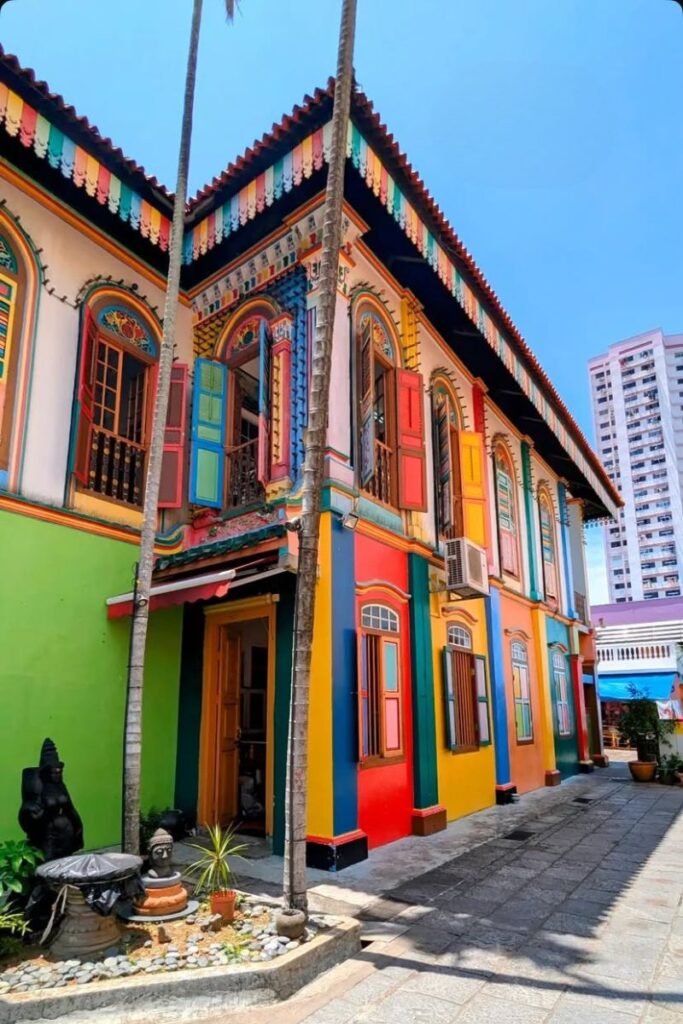The House of Tan Teng Niah, painted in bold rainbow colors, stands out under a bright blue sky in Little India. This historic Chinese villa is one of the most photographed landmarks and a popular stop for unusual things to do in Singapore.