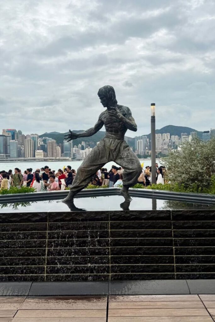 The famous Bruce Lee statue on the Avenue of Stars stands tall against the backdrop of Victoria Harbour and Hong Kong’s skyline. This iconic attraction is a must-see for tourists and first-timers deciding where to stay in Hong Kong, especially near hotels in central Hong Kong or on Hong Kong Island.