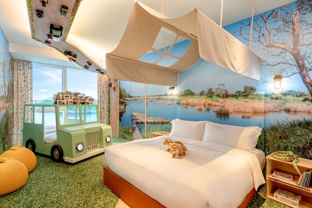 A safari-inspired kids’ hotel room with playful décor, a jeep-shaped bed, and toys creates a fun family atmosphere. This is one of the best hotels in Hong Kong with kids’ activities, making it ideal for families deciding where to stay in Hong Kong near Disneyland or tourist attractions.