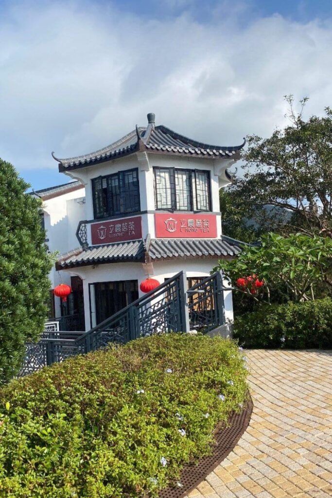 Traditional-style Lantau Island tea house with red lanterns and tiled roof. A charming stop when visiting the Big Buddha Hong Kong.