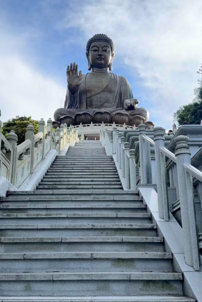 View from the stone staircase leading directly up to the Tian Tian Buddha Hong Kong. Climbing these steps is a highlight of visiting the biggest Buddha in Hong Kong.