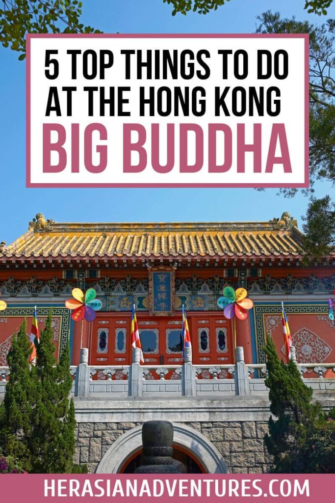 Front view of a traditional Chinese temple with golden rooftops, colorful pinwheels, and flags, overlaid with text “5 Top Things to Do at the Hong Kong Big Buddha.” Visiting this temple is one of the most recommended activities near the Big Buddha Hong Kong Lantau Island.