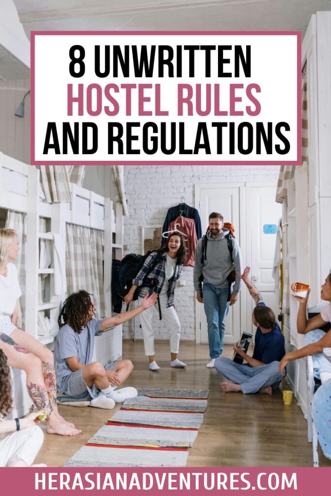 A group of backpackers greet each other in a bright dorm hallway with bunks on either side, overlaid with text reading “8 Unwritten Hostel Rules and Regulations.” This image perfectly conveys hostel etiquette and the social side of staying in hostels.